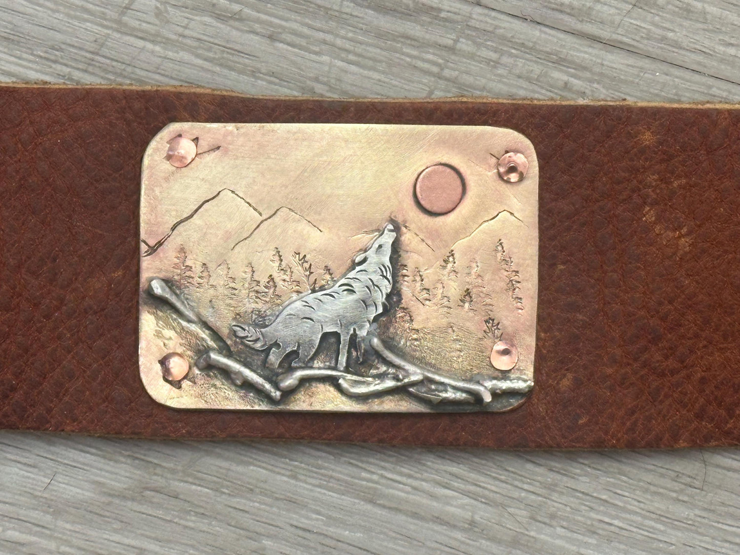 Wide rustic wolf roaming mountain cuff, old west, handcrafted metalwork, western button snap closure, western fashion
