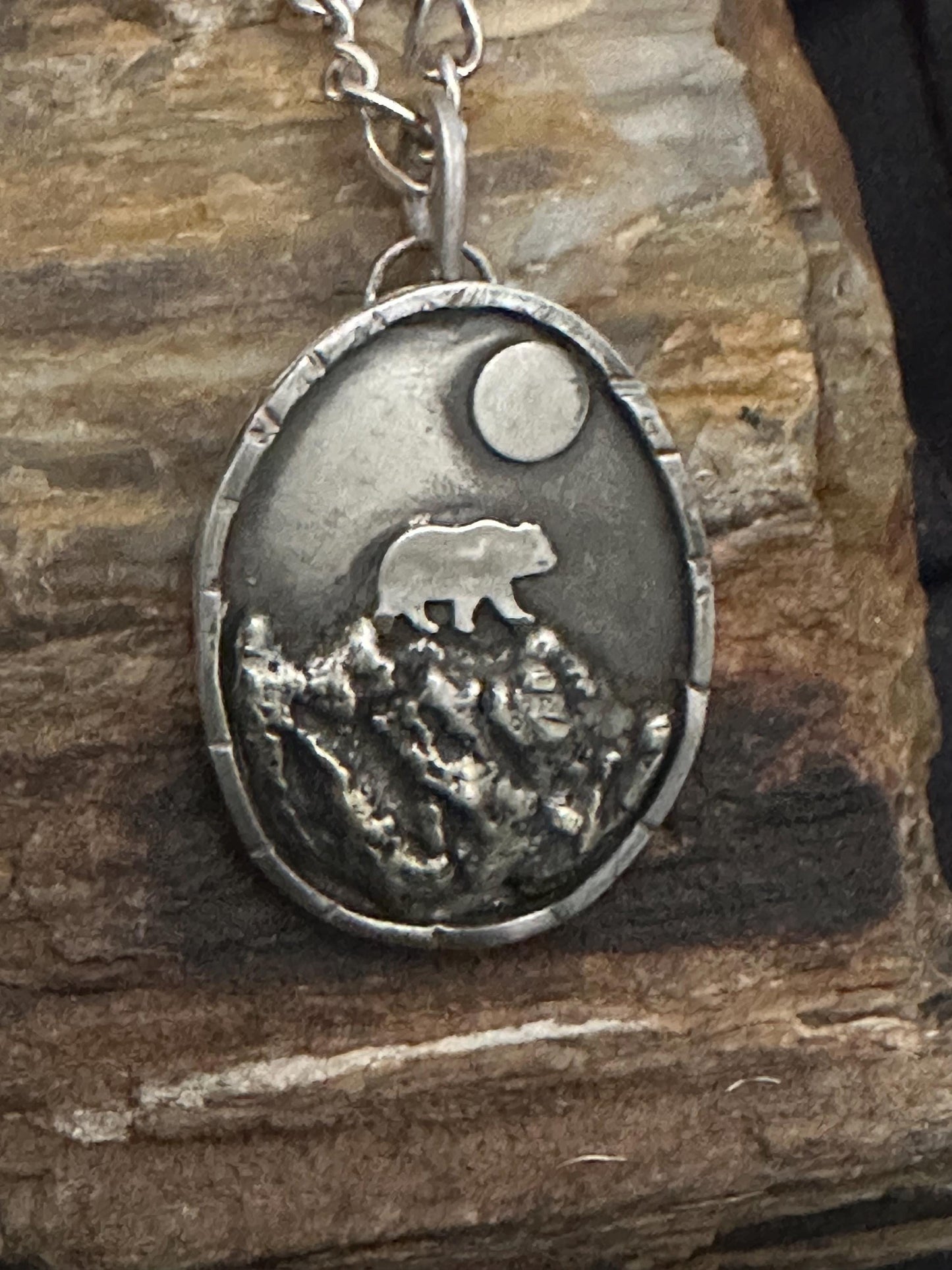 Bear in mountains hand forged silver necklace