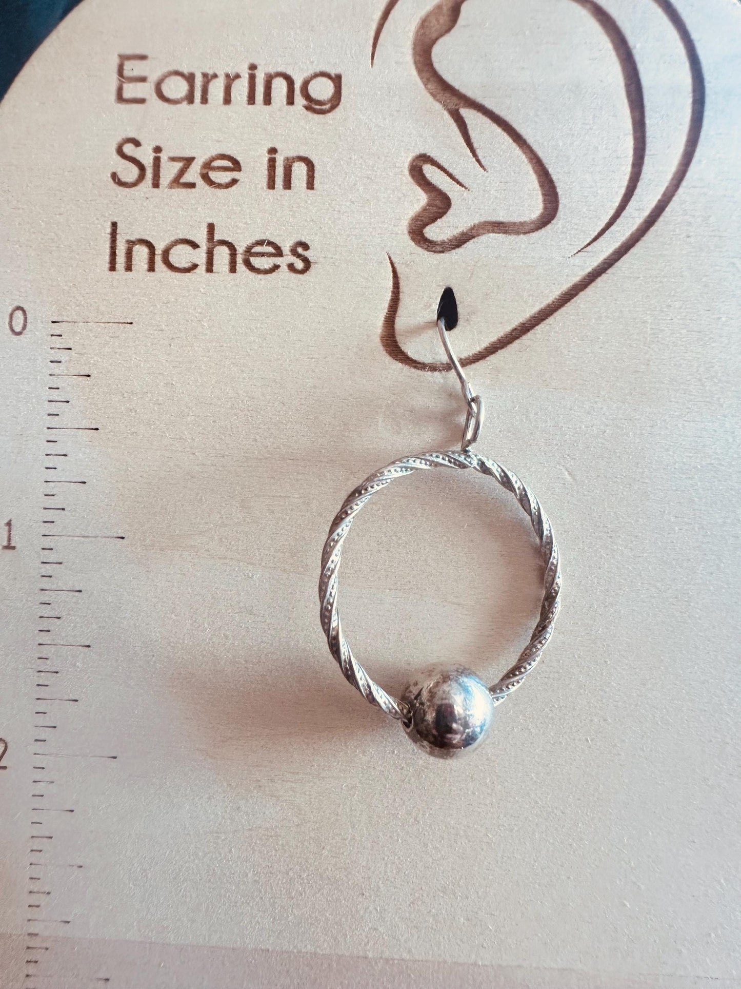 Handmade hoop earrings with free spinning silver bead