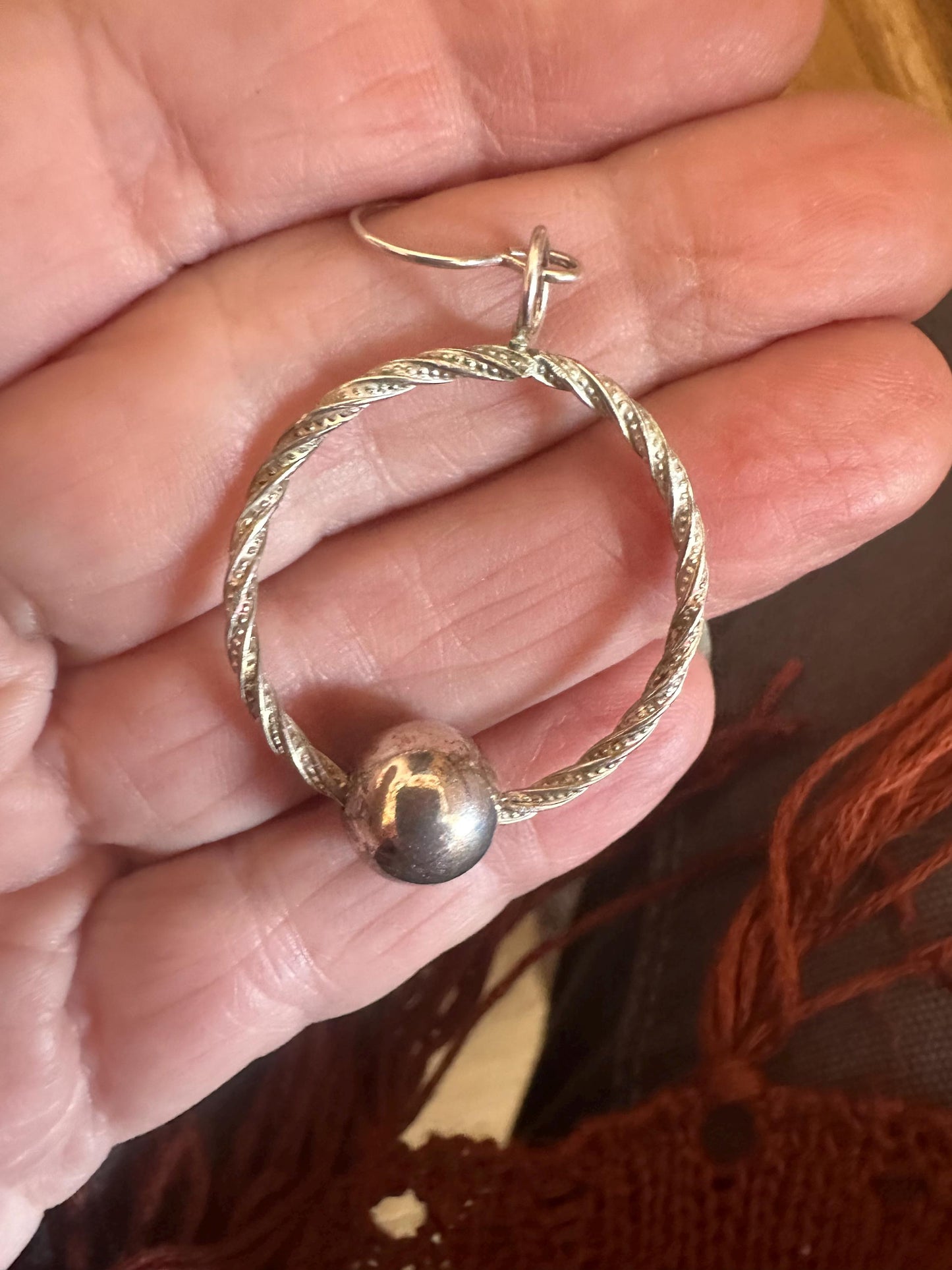 Handmade hoop earrings with free spinning silver bead