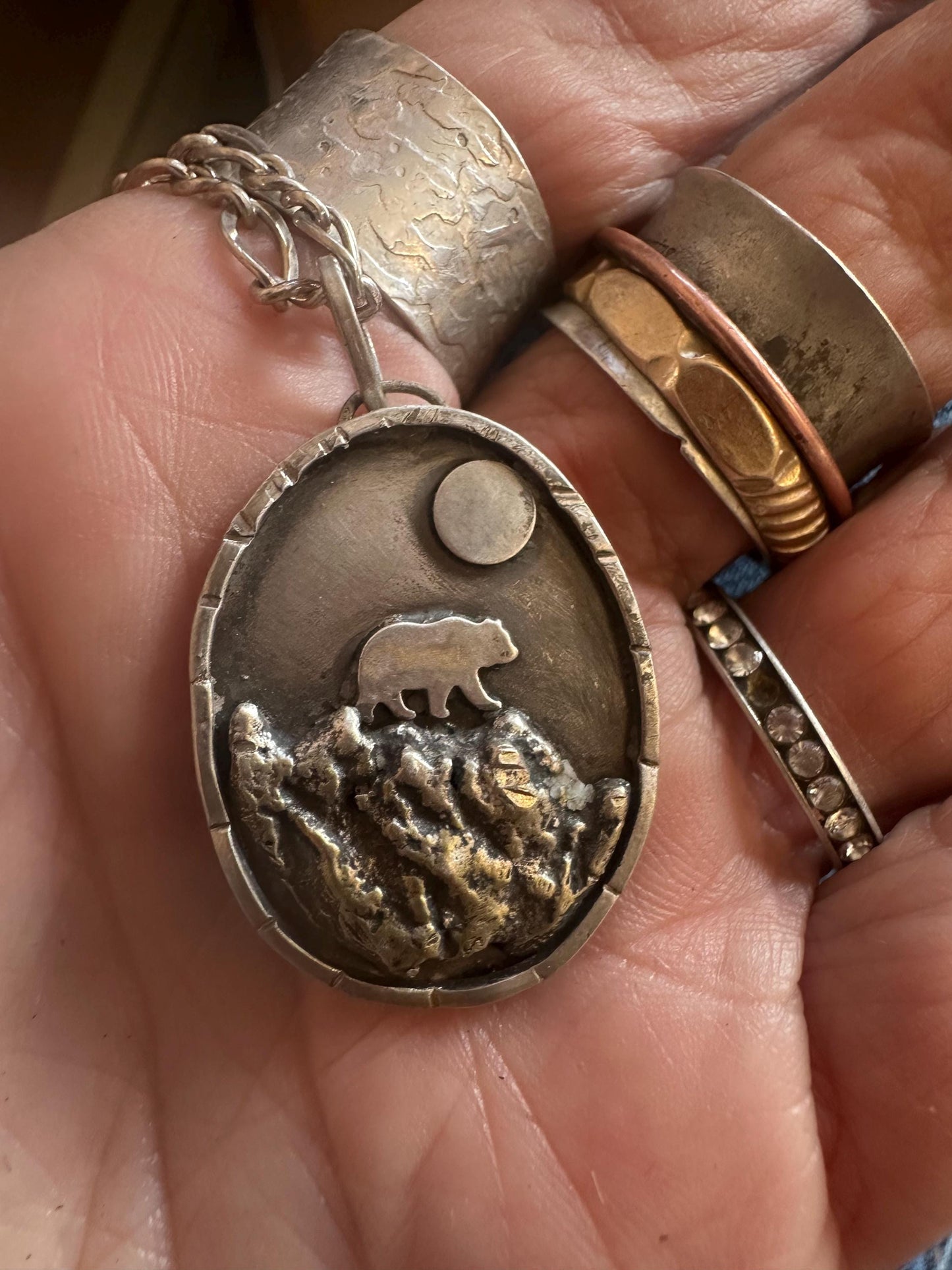 Bear in mountains hand forged silver necklace
