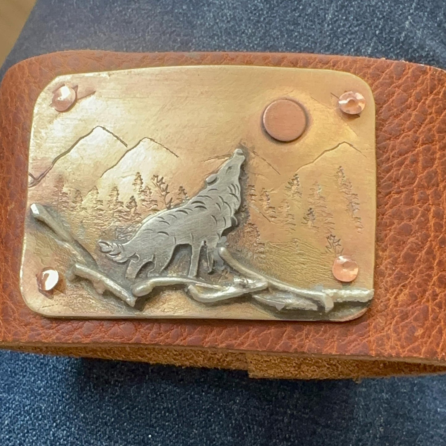 Wide rustic wolf roaming mountain cuff, old west, handcrafted metalwork, western button snap closure, western fashion