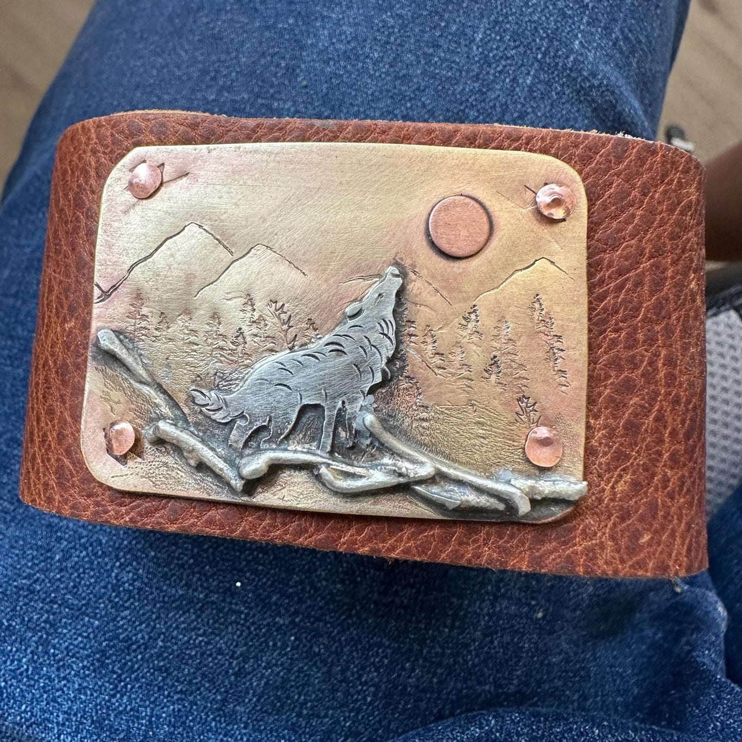 Wide rustic wolf roaming mountain cuff, old west, handcrafted metalwork, western button snap closure, western fashion