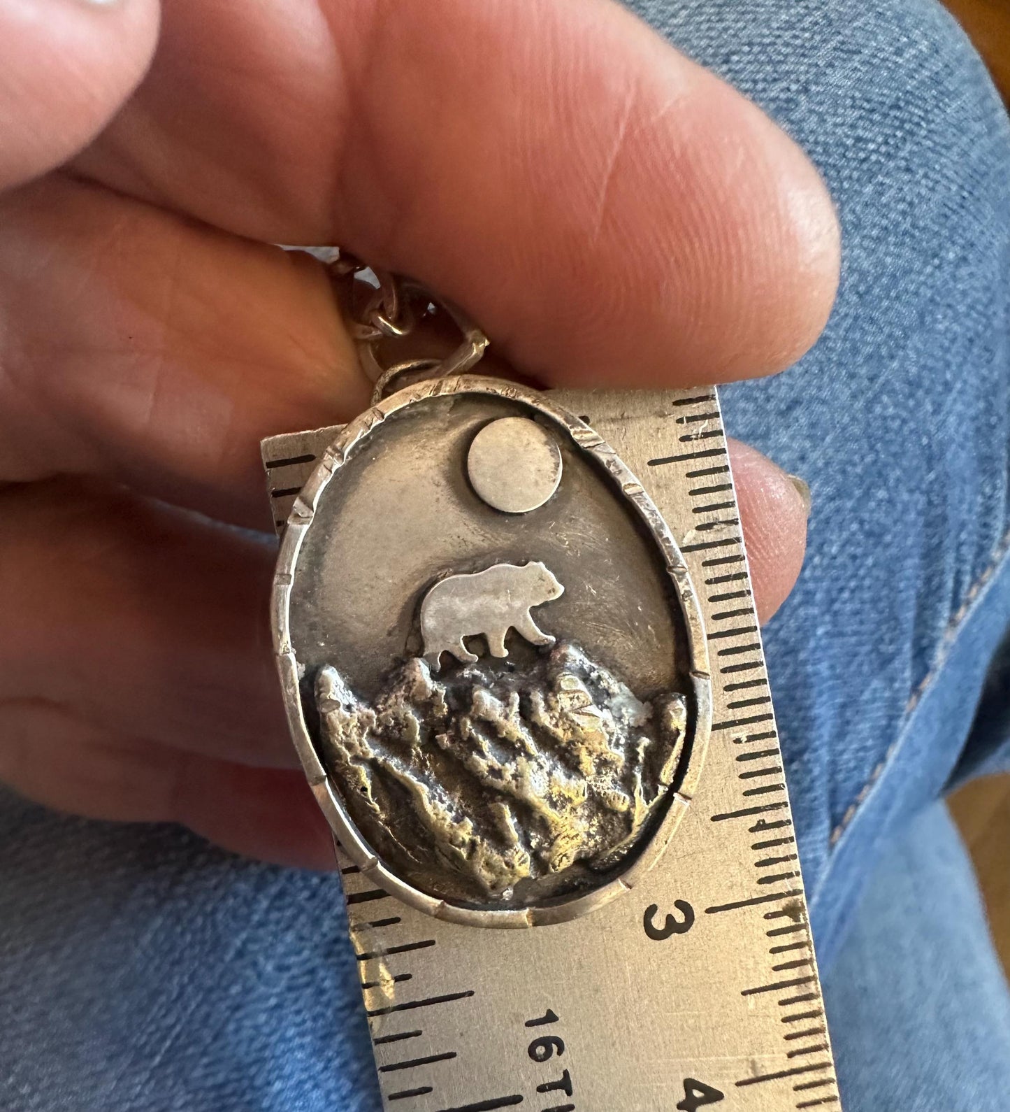 Bear in mountains hand forged silver necklace