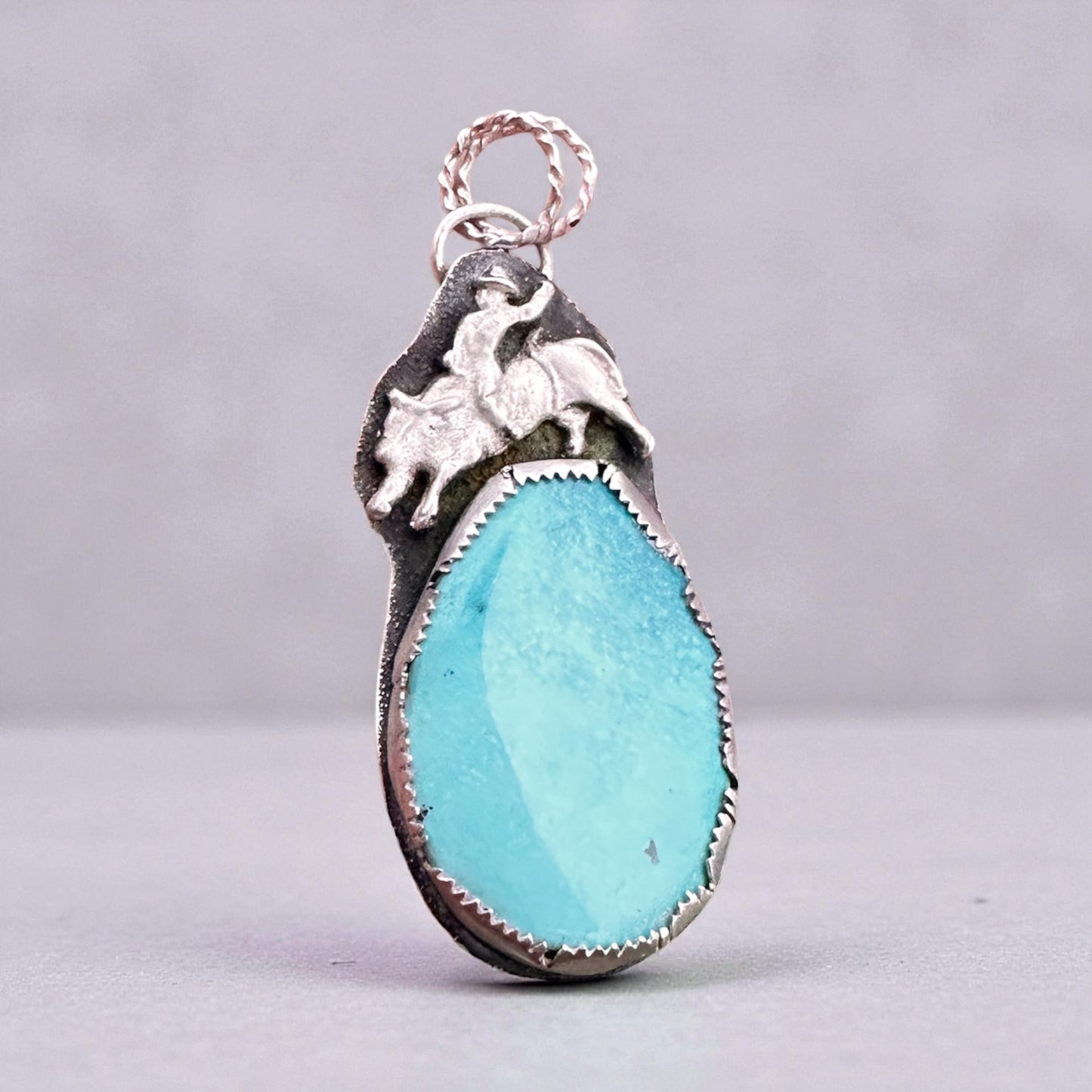 Ride the Spirit of the West – Handcrafted Bull Rider Turquoise Pendant