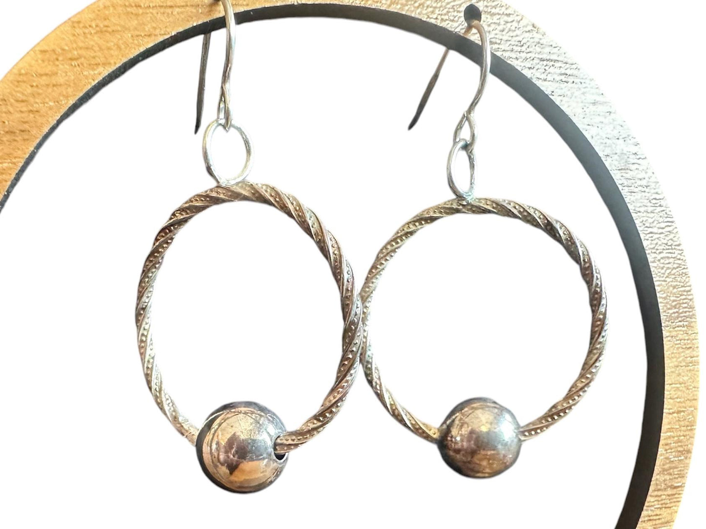 Handmade hoop earrings with free spinning silver bead